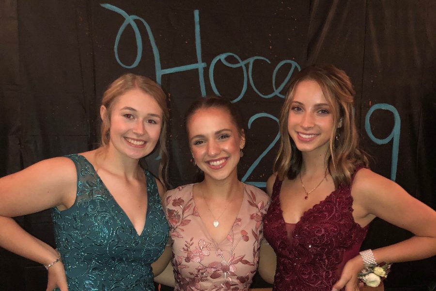Caroline Nagle, center, poses with court members Casi Shade and Jaydyn Shuke, at Saturdays Homecoming dance.
