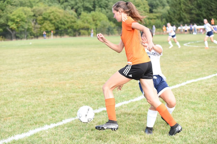 Sophia Nelson pushes the ball ahead against Penns Valley.