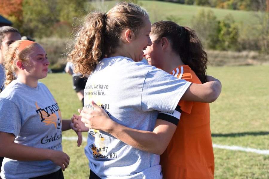B-A sophomore Jaylee Shuke hugs Tyrones Cate Baran during Senior Day ceremonies for the girls soccer team. 