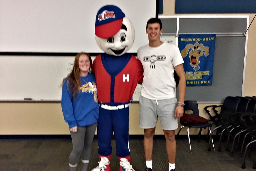 Travis Luensmann and Haley Schmidt pose for a picture with Homer for Red Ribbon Week.