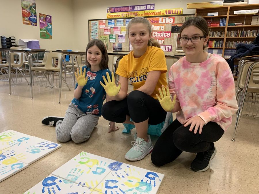 7th grade students (L to R) Emily Zacker, Gianna Juart and Kaitlynn Brallier making their mark on the middle school.