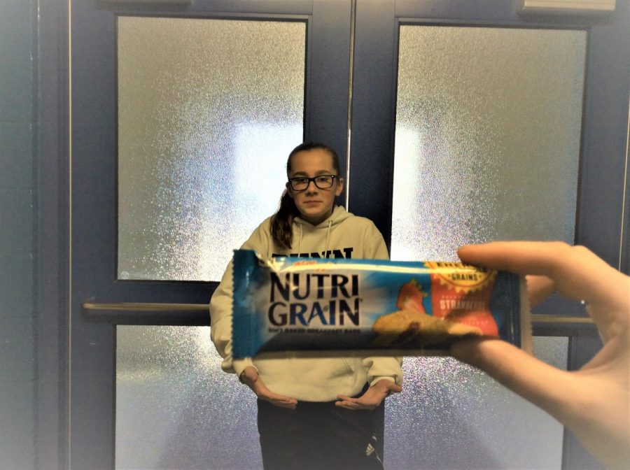 7th grader Briley Campbell enjoys eating strawberry NutriGrain bars as an after school snack.