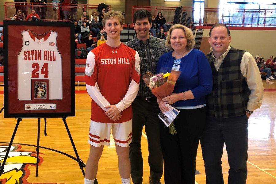 Nathan+Davis%2C+shown+with+brother+Noah%2C+mother+Shelly+and+father+Todd%2C+recently+wrapped+up+an+outstanding+basketball+career+at+Seton+Hill.