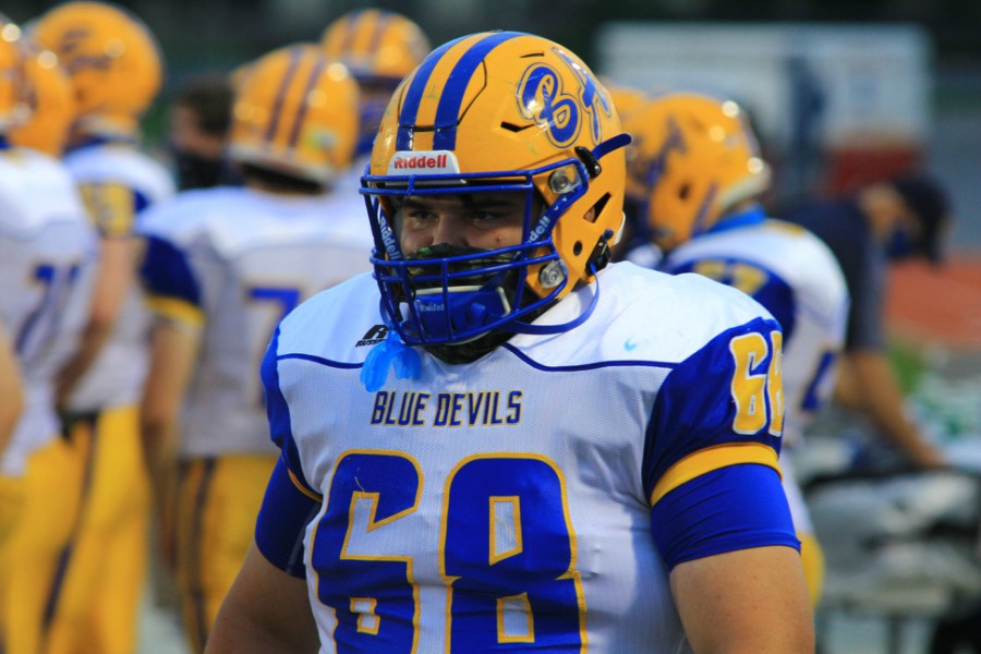 NIc Caracciolo wears a mask in the Devils football opener.