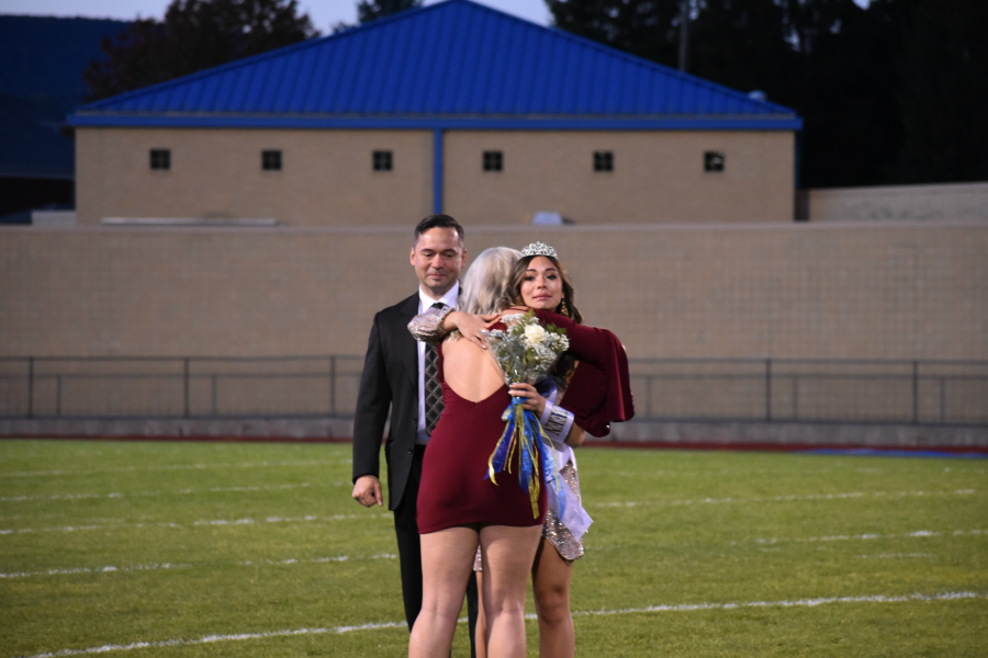 Malia Danish gets a hug from Jamyson Focht as she is crowned 2020 Homecoming queen.