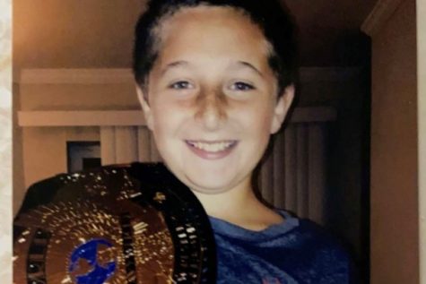 Trenton Pellegrino, seen here in his elementary days with a WWE championship, has been a serious World Wrestling Entertainment fan for most of his life.