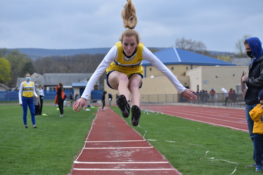 Brielle Campbell takes to the air in the long jump against Tyrone.