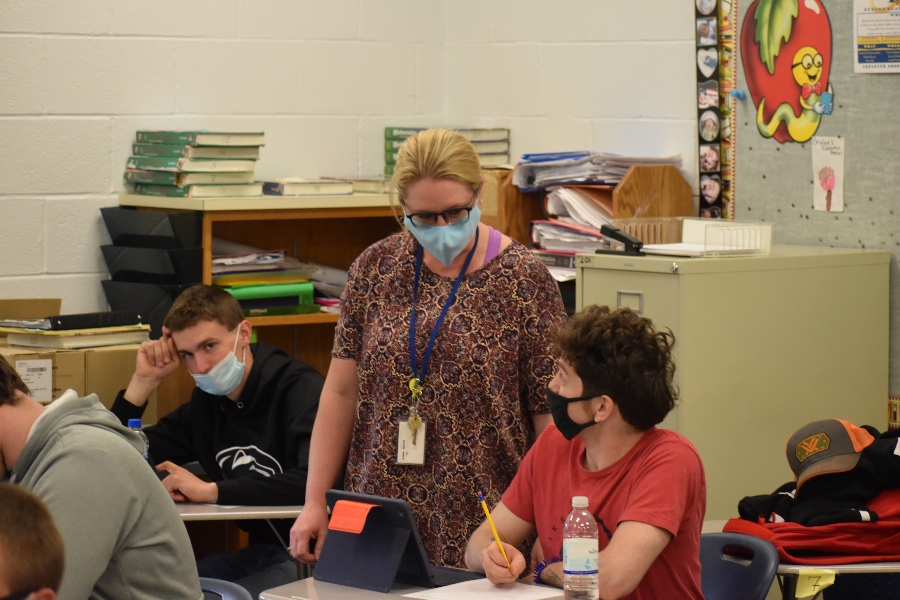 Mrs. Riddle helps a student in one of her math classes.