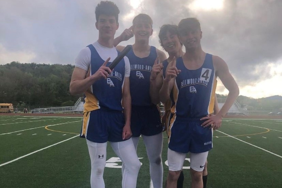 The+Blue+Devils+4X400+meter+relay+team+of+Sean+Mallon%2C+Cooper+Keen%2C+Hunter+Shawley%2C+and+Kenny+Robison+celebrate+their+victory+at+the+West+Central+Coaches+Meet.