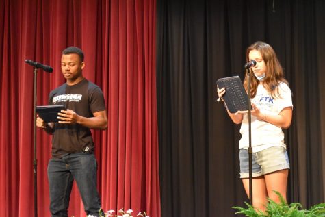 Caroline Nagle and Alex Taylor deliver their poem about concussions at the poetry slam.