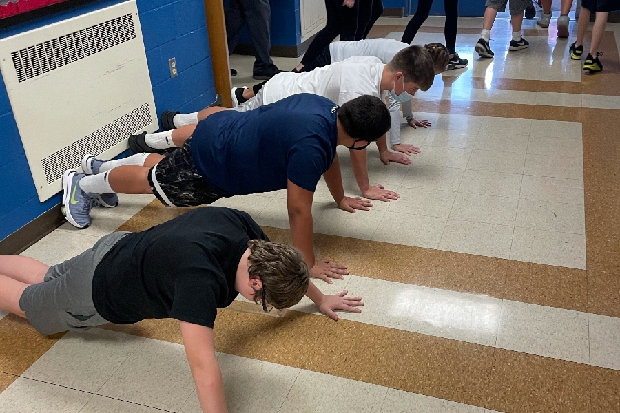 Middle+school+boys+bang+out+their+22+pushups+as+part+of+the+22+Pushup+Challenge+to+support+veterans+struggling+with+thoughts+of+self-harm.