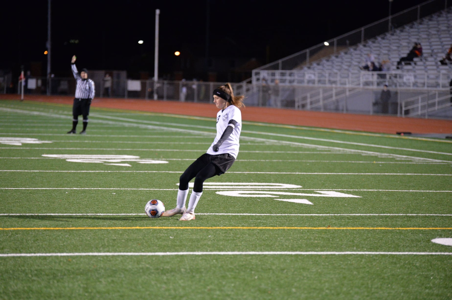 Sophia Nelson attempts a free kick in the second half of the District 6 3A championship game.