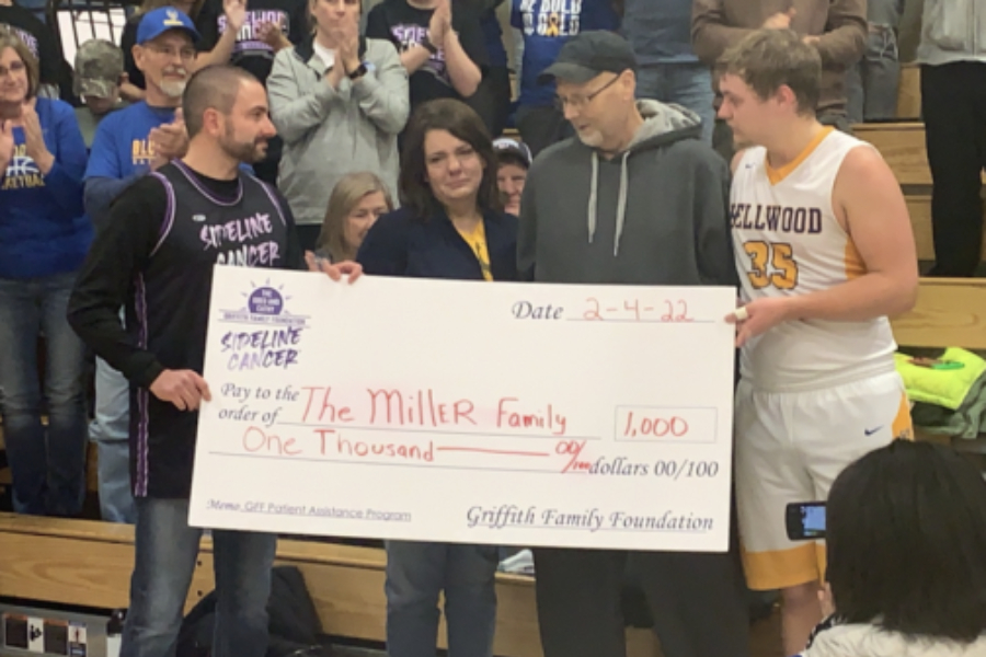 Dawson Miller and his family received a $1,000 check for Dawsons father Doug, who is battling pancreatic cancer.