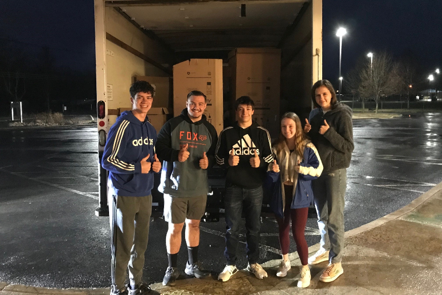 Sean Mallon, Dominic Caracciolo, Xander Shank, Alexis Lovrich, and Sophia Nelson helped transport cereal boxes to St. Vincent DePaul.