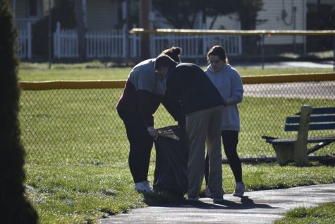 Students from Mr. Whitlings first period earth and space science class cleaning around the baseball field in North Side.