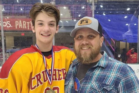 Maverick Baker and his father Justin following a hockey game earlier this year..