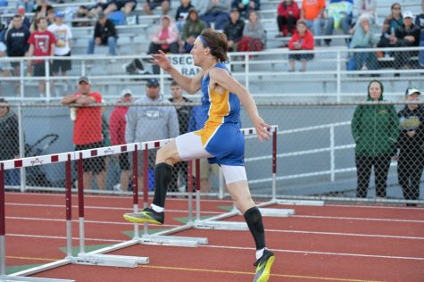 Hunter Shawley goes over the last hurdle to win the 300-meter race at the District 6 2A championships.
