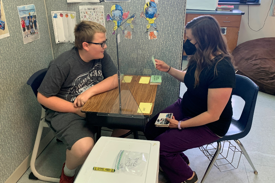 Mrs. Elder works with ninth grader Vincent Daughenbaugh.