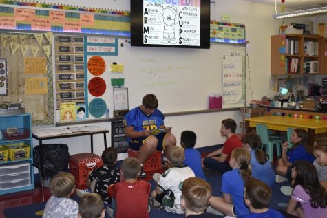 Jackson Grassmyer reads to students at Myers Elementary.
