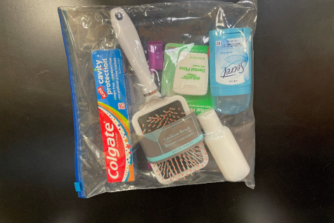 Nurse Kelly Hoover distributed hygiene kits to middle school students at a recent meeting about keeping clean.