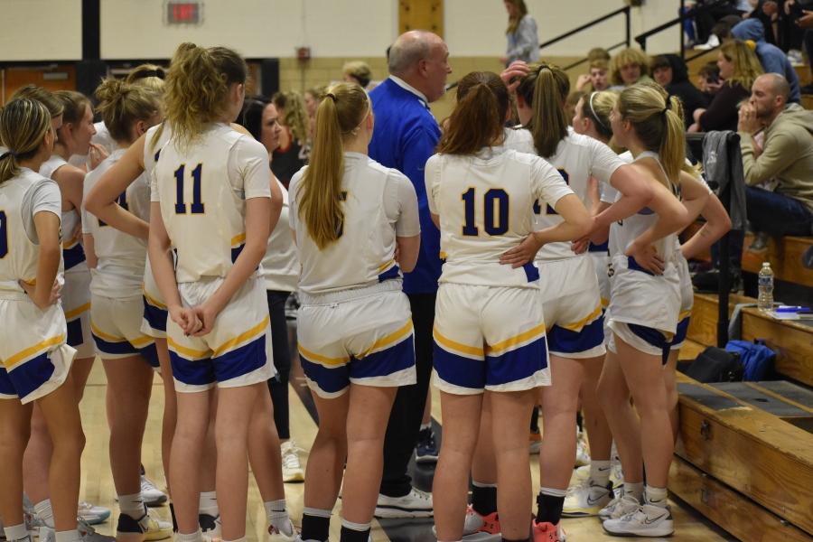The Bellwood-Antis Lady Blue Devils get some words of advice from Coach Jim Swaney during a timeout in the Reliance Bank Holiday Basketball Tournament.