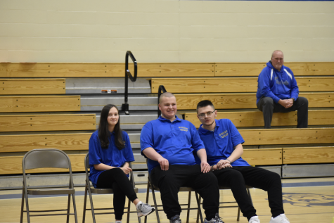 Maddy Pulcinello (right) and Tighe Eaken (left) wait with Noah Larson for their turn in Wednesdays bocce match against Claysburg-Kimmel.