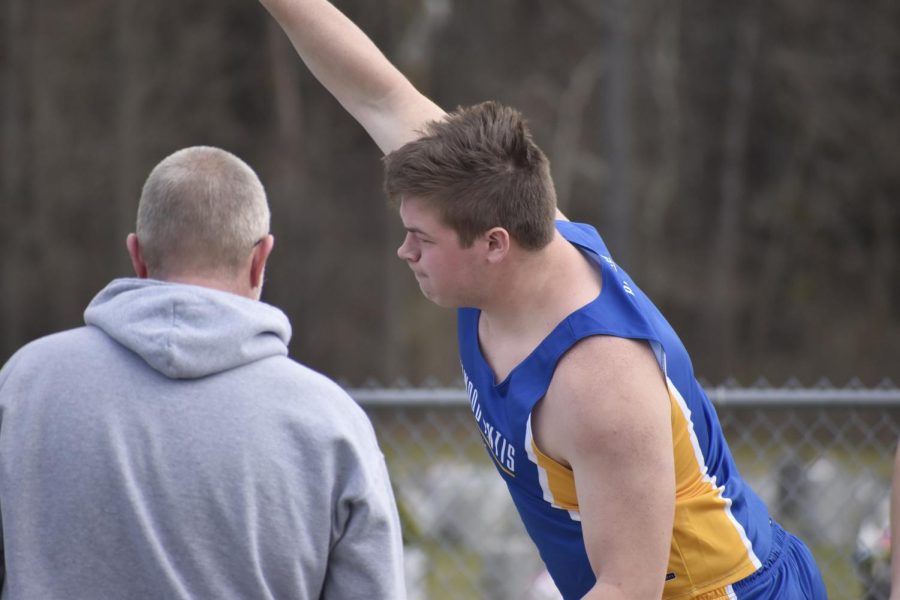 Andrew Nycum throwing shotput. (Bailee Conway)