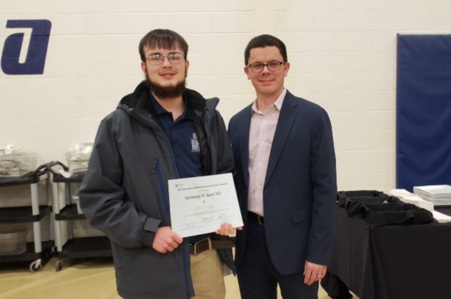 Philip receiving awards for his research.