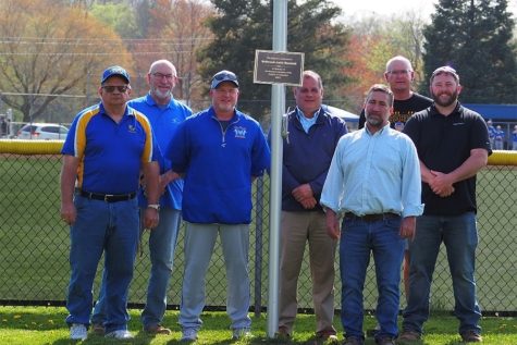 The dedication of a new flag pole at the baseball field included (r to l): Assistant AD John Garritano,  KOC member Mark Miner, Coach Tom Partner, Superintendent Edward DiSabato, KOC member Todd Beiswenger, board member  Kevin Luensmann, and Director of Facilities Tom Kovac.  (Julia Johnson)
