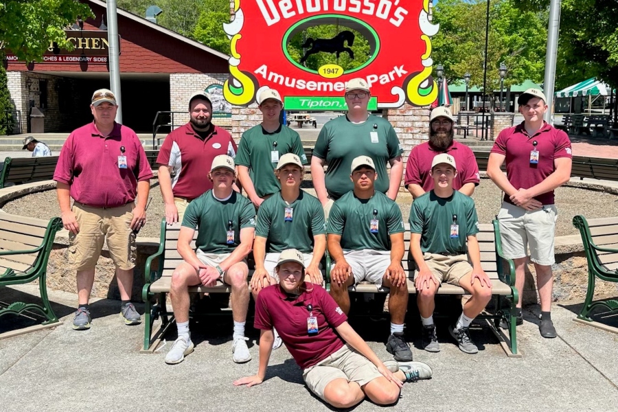 JoJo Caswell, front, sits with the DelGrossos warehouse staff.