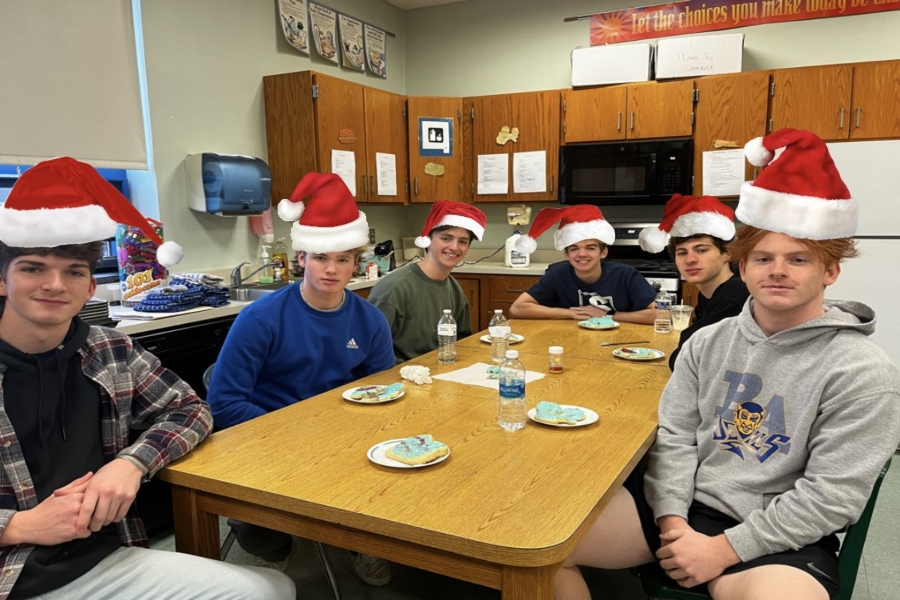 Festive, hungry students ready to devour some Christmas cookies.