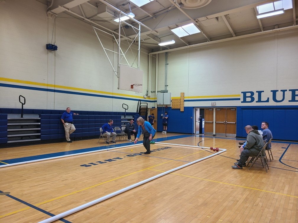 Mrs. Grassmyers takes her turn in the bocce teams practice game against B-A school employees.