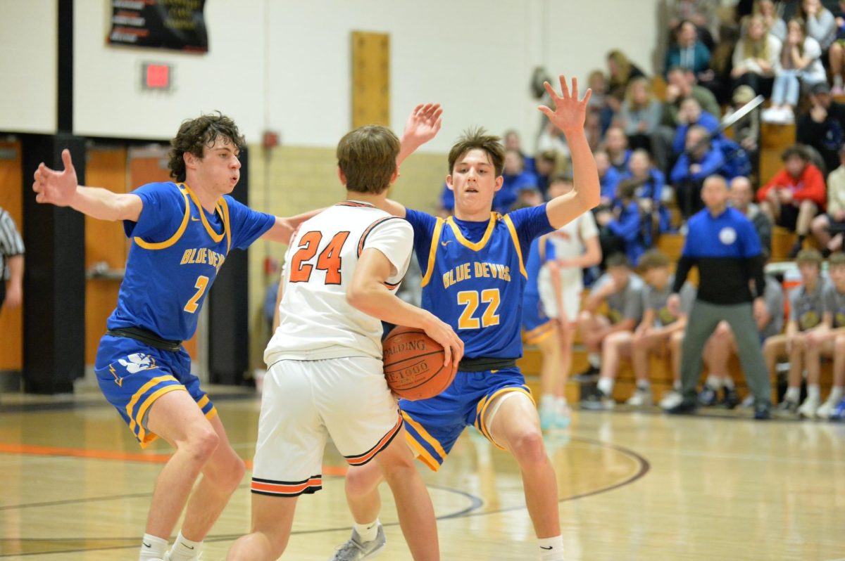 Anthony Caracciolo and Holden Schreier look to double the ball against Tyrone.