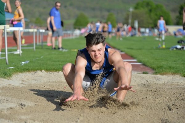 Dalton Poorman lands with the first place triple jump at Mondays Bellwood-Antis Invitational.