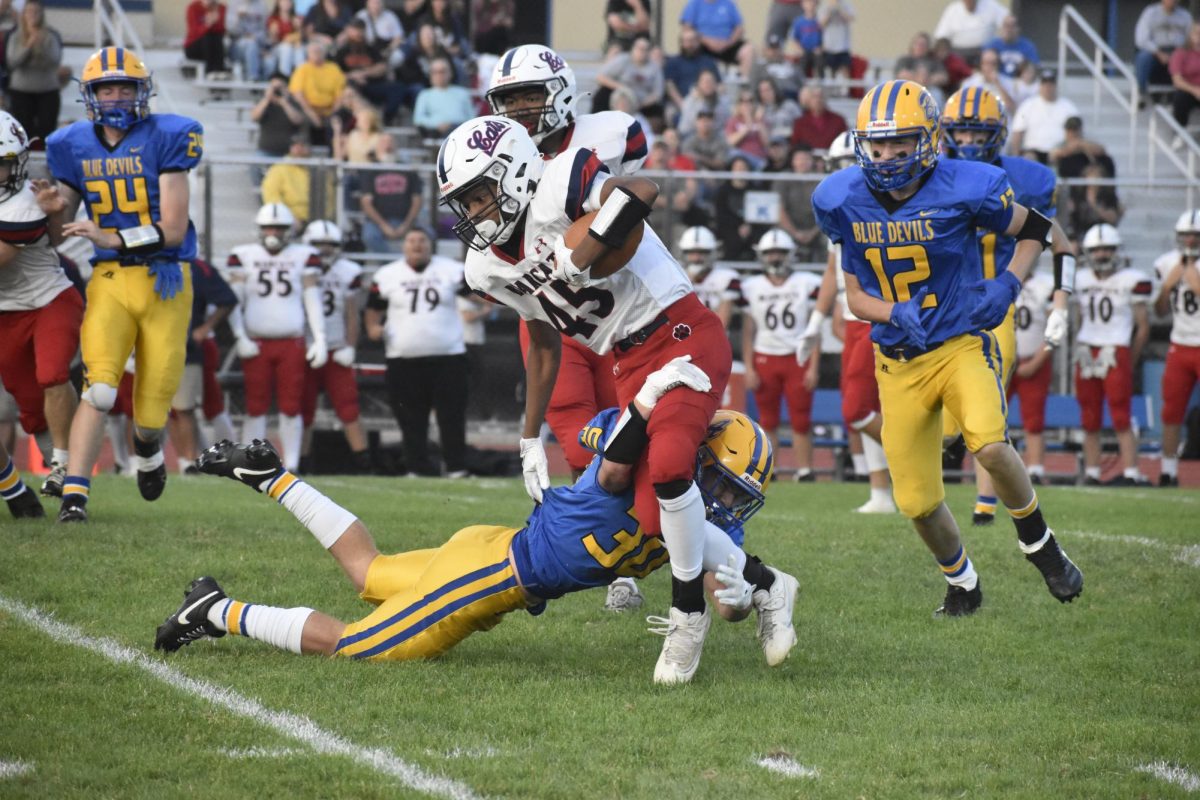 Colin Gibbons reaches for the tackle against the Bearcats.