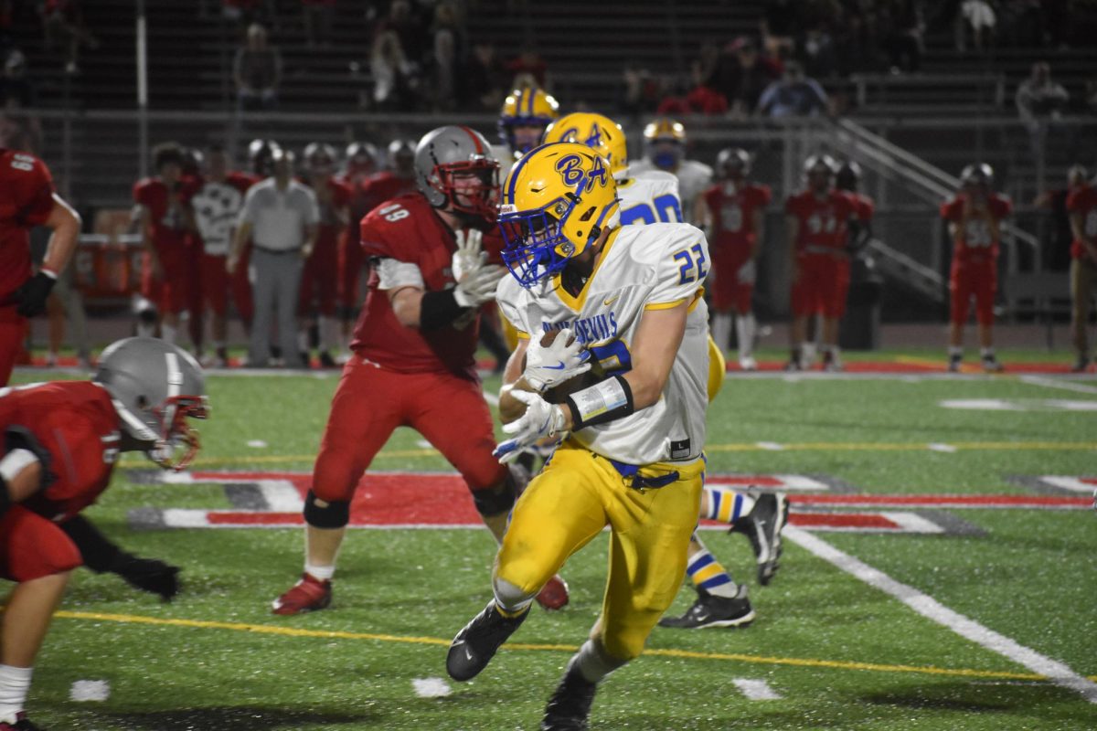 Bradyn Partner runs the football against Westmont.