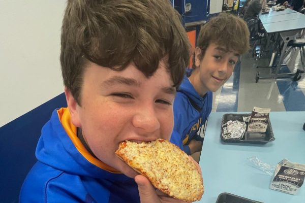 Dean Hoffer enjoys a thick slice of pizza in the Bellwood-Antis cafeteria.