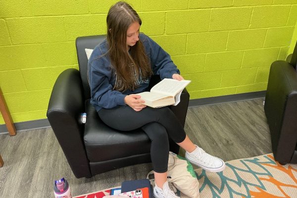 B-A senior Halee Young spends her study hall in the media center reading a new book she picked up - the perfect way to spend National Read a Book Day.