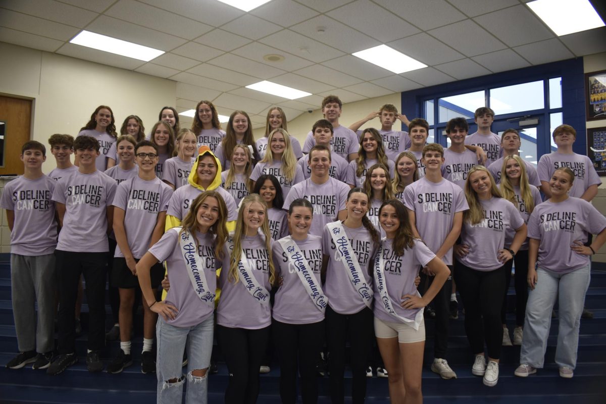 The entire homecoming court dressed in their Sideline Cancer shirts