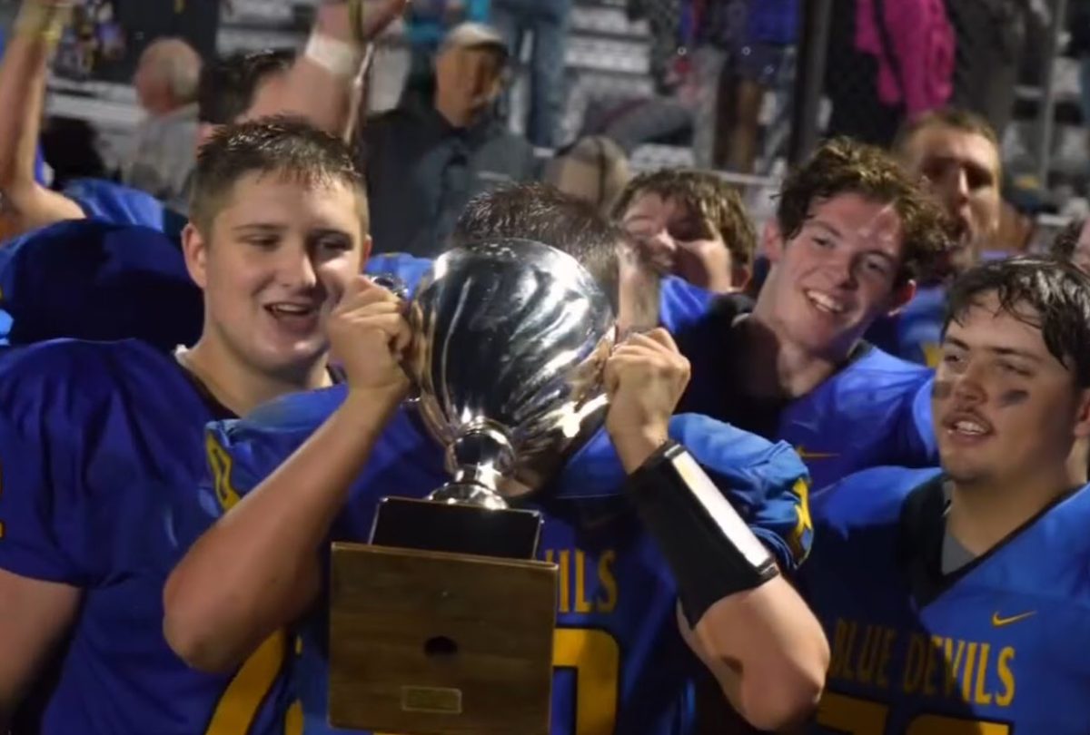 Bellwood-Antis senior Cayden Pellegrine sips from the I Can Cup, sponsored by Sideline Cancer, after the Blue Devil's 28-0 win over Philipsburg-Osceola on Homecoming. 