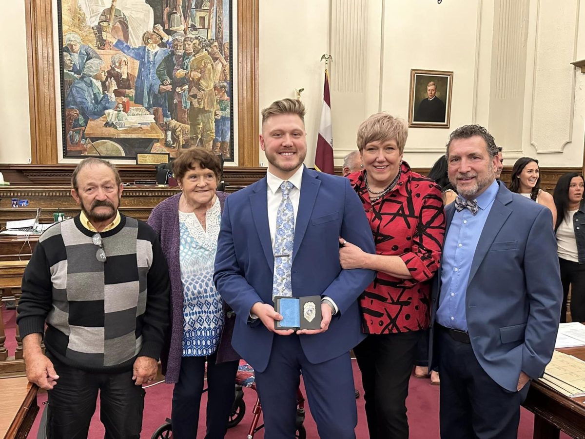 B-A grad Sawyer Kline (2017) celebrate with his family after being sworn in as an Assistant District Attorney in Montgomery County.