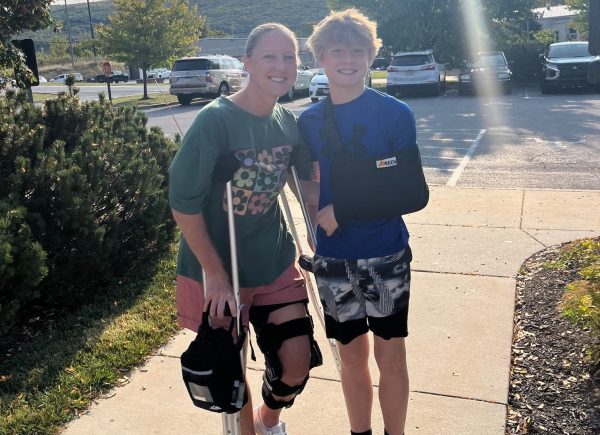 Mrs. Naylor stands with her son Christian outside of University Orthopedic, where both were being treated for injuries. Mrs. Naylor completely tore her hamstring in July and underwent surgery in August.