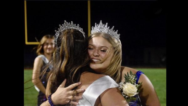 Miranda Tornatore embracing Gianna Juart after passing off the crown.