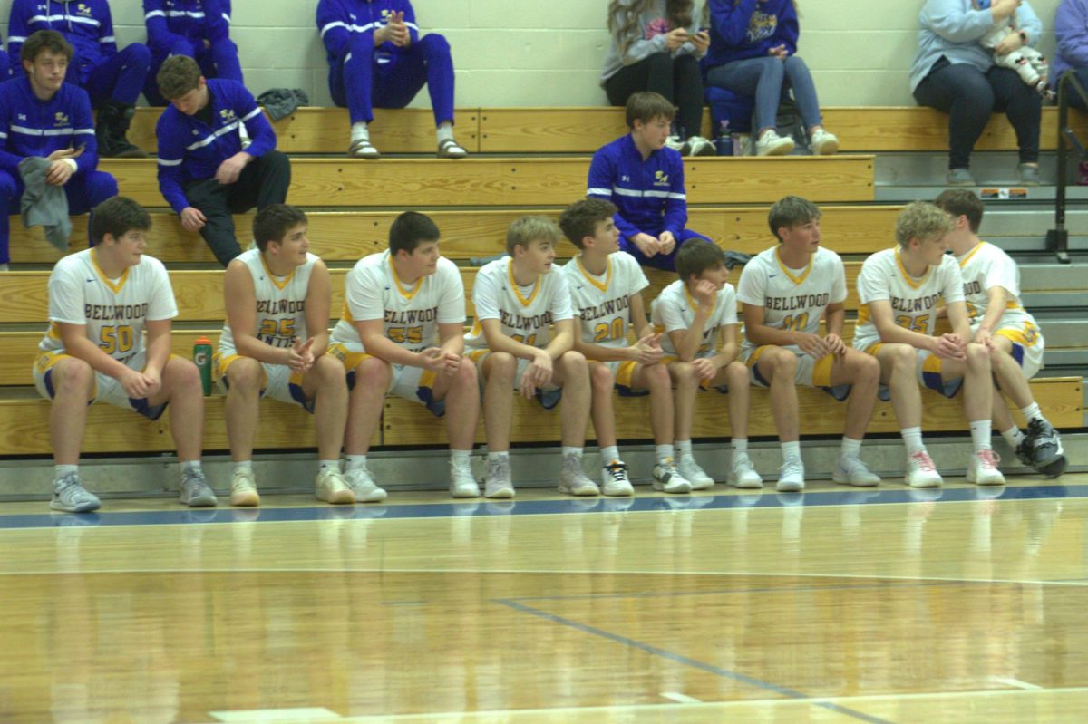 B-A's younger players look on before the varsity team tips it off against the Bearcats.