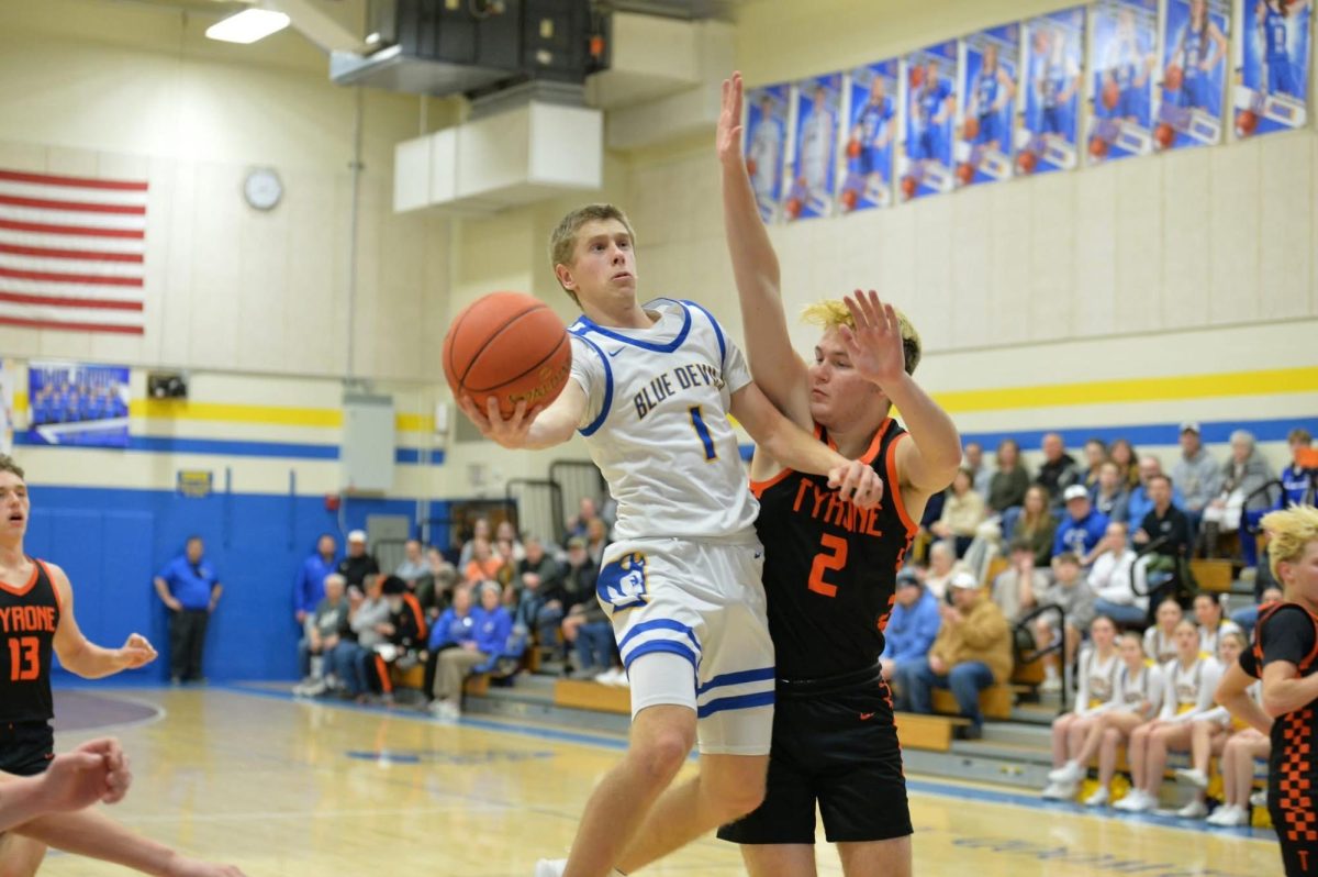 Jackson Dorminy drives past Ashton Walk for a layup in the Backyard Brawl against Tyrone last night in Bellwood. Dorminy finished with 18, but B-A lost its 11th straight game.