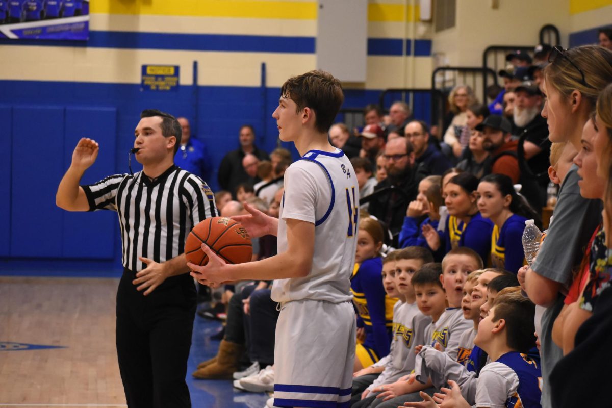 Curtis looks to inbound the ball.