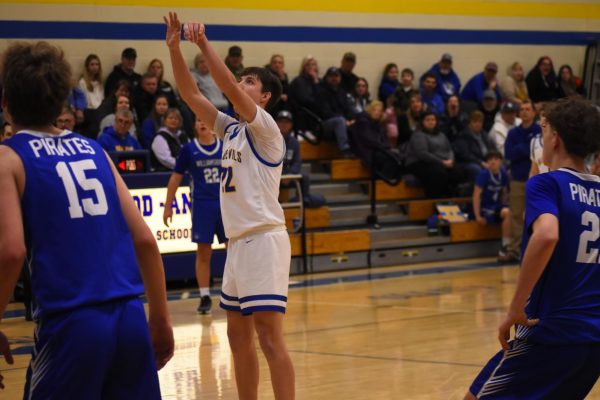 Holden Schreier sinks a foul shot late against Williamsburg to seal the Blue Devils' second victory of the season.