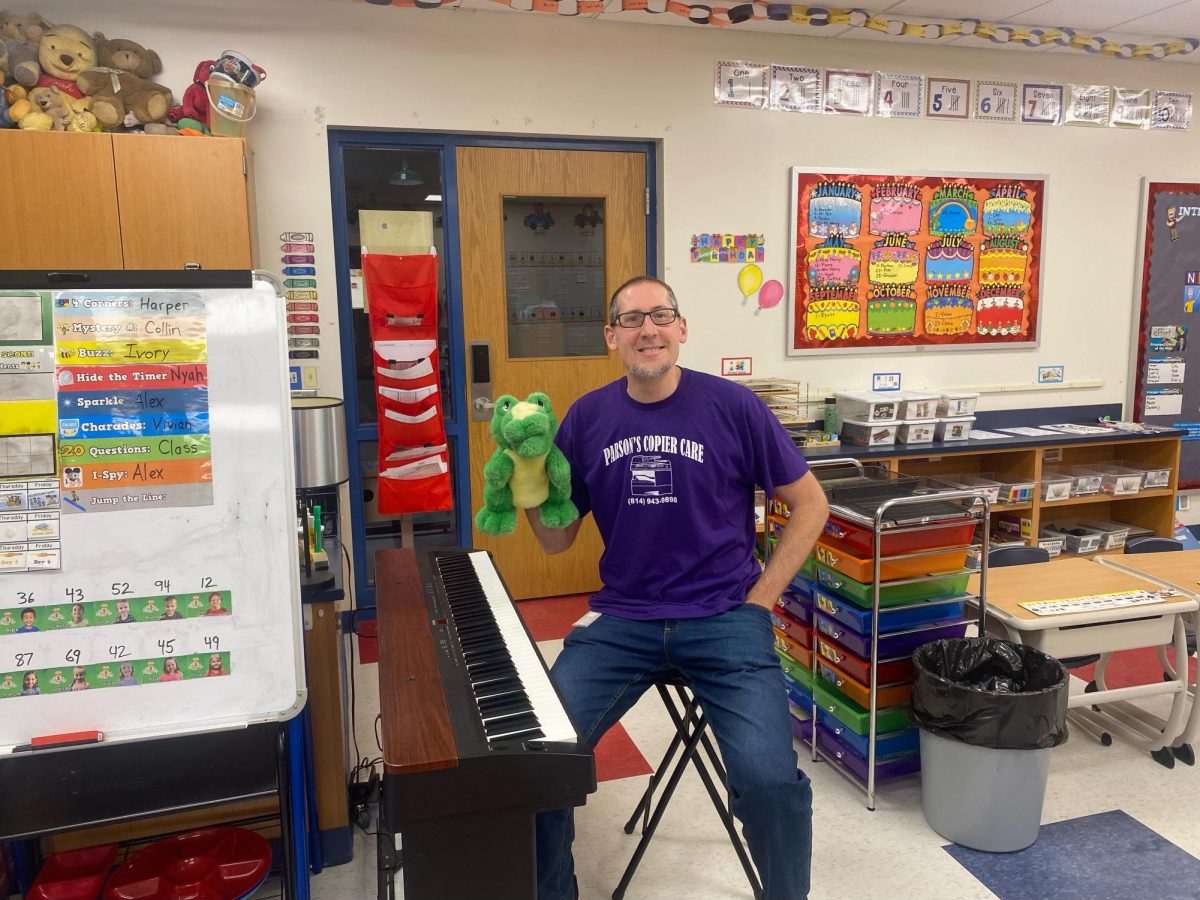 Myers kindergarten teacher Mr. Harry is still making music, updating his YouTube channel, and motivating students to learn with his unique delivery.