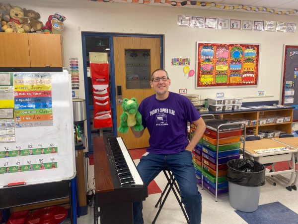 Myers kindergarten teacher Mr. Harry is still making music, updating his YouTube channel, and motivating students to learn with his unique delivery.