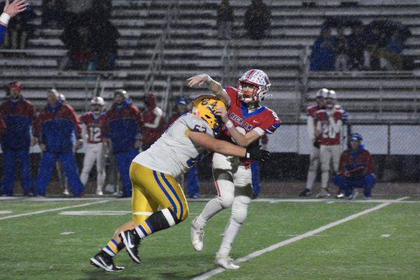 Photo of Bryson Hescox rushing the quarterback
